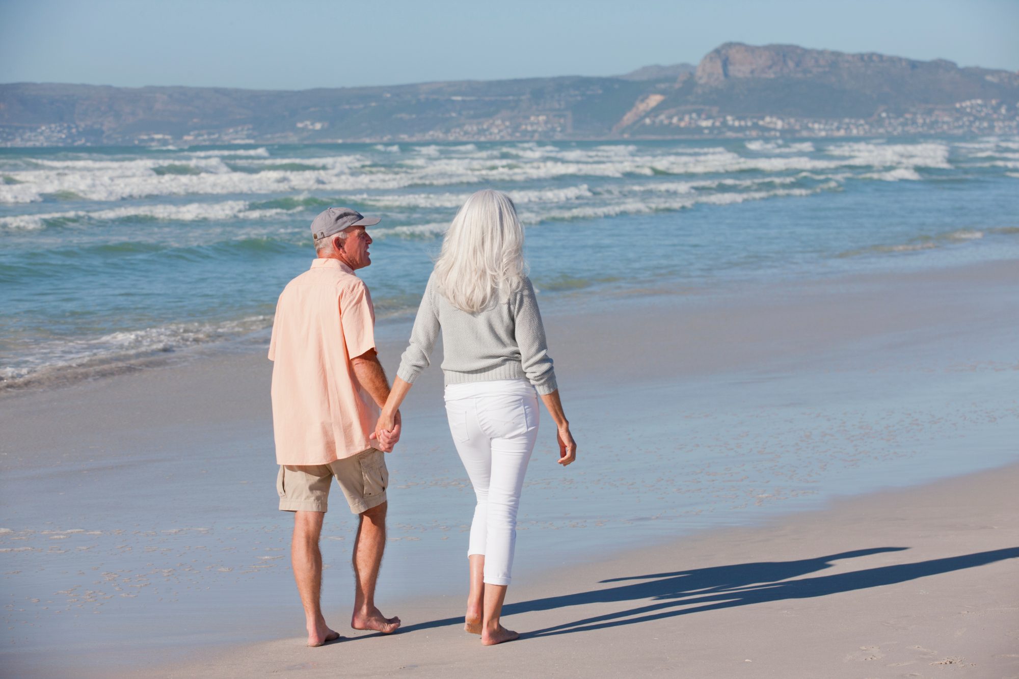 A couple walking together along the shore