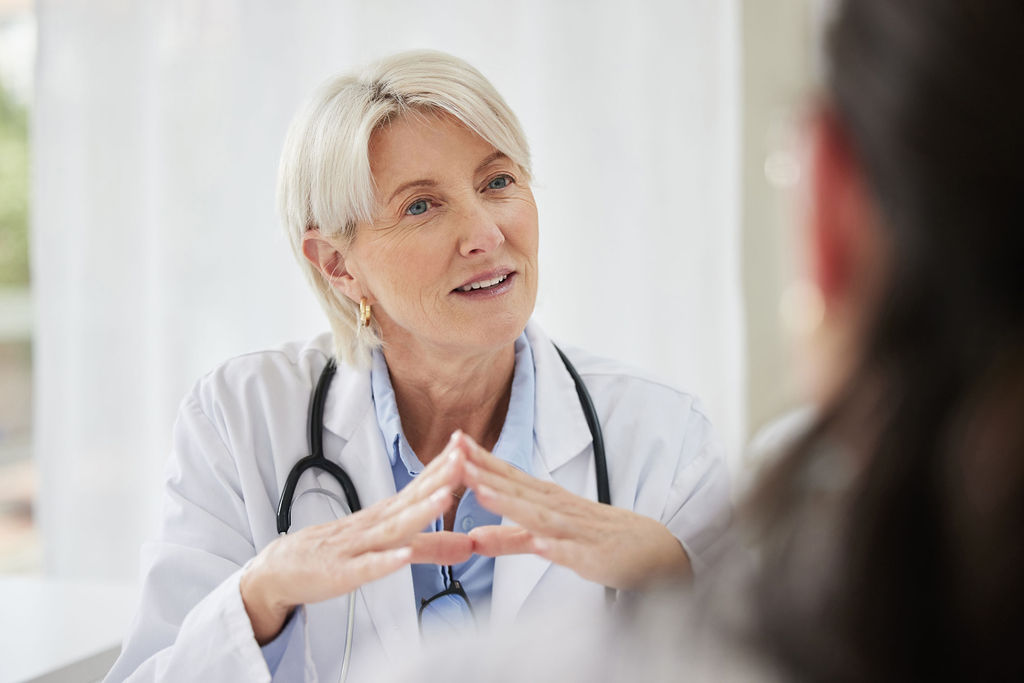 A physician in consultation with a patient