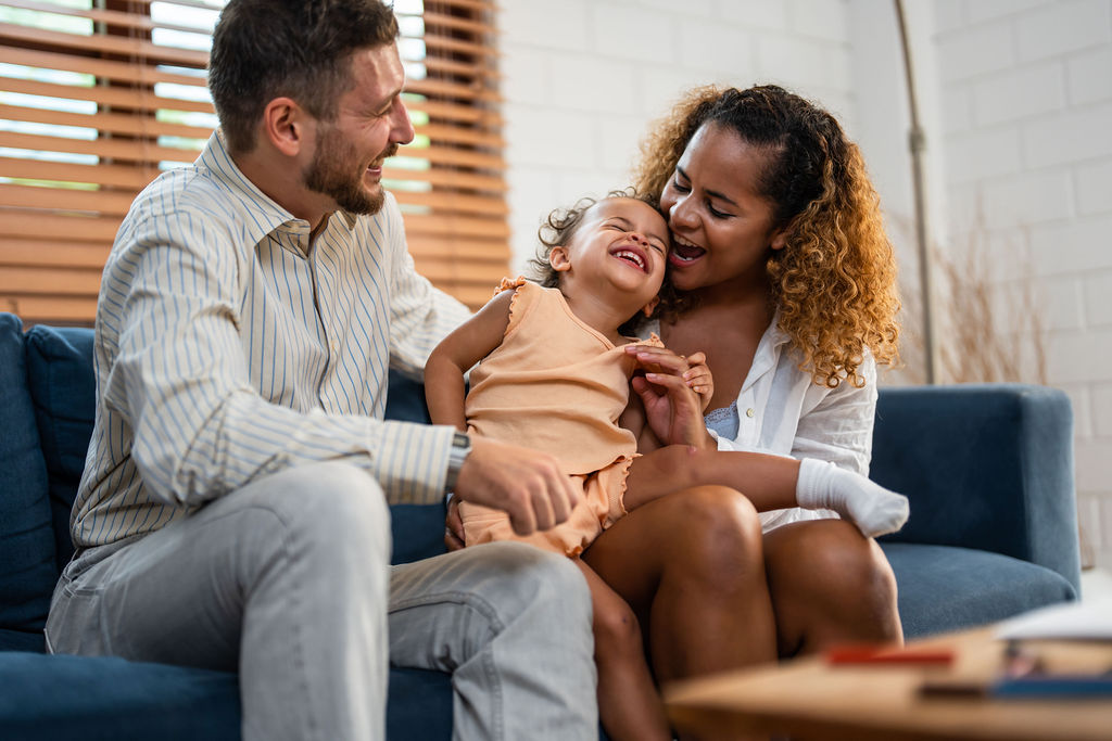 A family laughing together at home